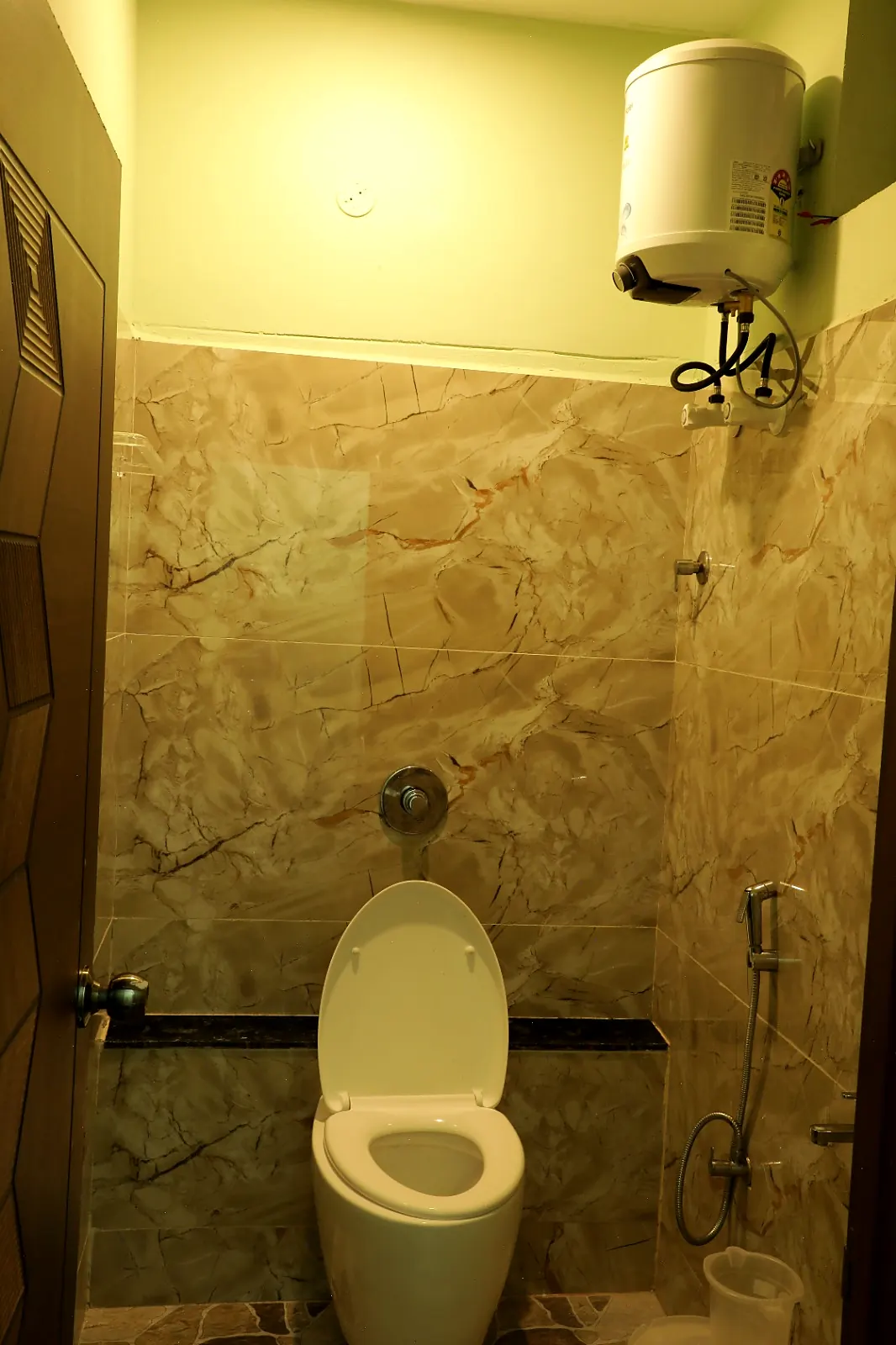 Marble-finish bathroom with hot water